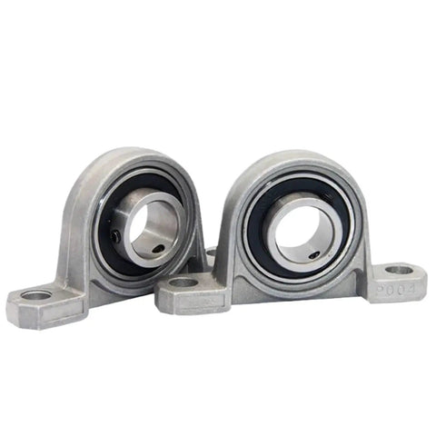 Super Heavy Duty Pillow Block Bearings 4 Pack Universal Mounted Units For Machines And Engines Easy Insert Smooth Runs Top Shelf Steel Built Tough No Slack During Fast Operation Big Savings On Pro Gear For Your Shop Jobs Ready To Ship Fast Delivery. Two steel pillow block bearings on white background