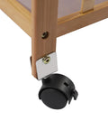 Close-up of the whisper quiet caster wheel on Heavy Duty Carbonized Bamboo Rolling Cart With Whisper Quiet Caster Wheels Plus Roomy Storage Drawers Easy Glide Mobile Kitchen Sidekick For Coffee Bars And Daily Grind Setup.