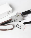 Handheld Pneumatic Belt Sander With Slick Rubber Grip And Quick Release Tensioner, 20x520 mm belt, includes tools and manual.
