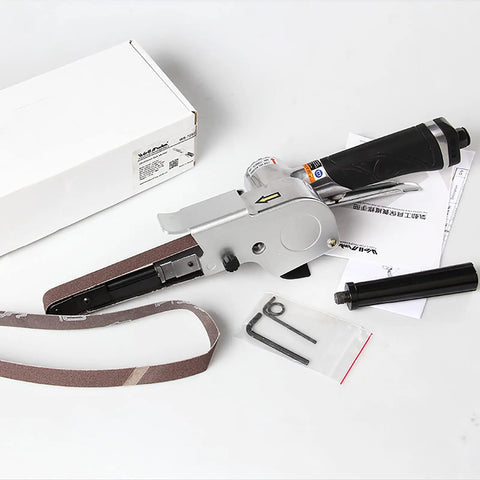 Handheld Pneumatic Belt Sander With Slick Rubber Grip And Quick Release Tensioner, 20x520 mm belt, includes tools and manual.