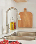 Flute Pull-Down Kitchen Faucet With POWERINSE Technology, Stainless Steel, 3-Function Spray, high arc gooseneck in modern kitchen.