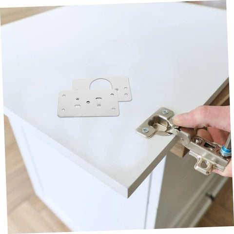 Stainless Steel Hinge Repair Plate Kit For Cabinets And Furniture Easy Install Quick Fix Hinges on white cabinet corner.