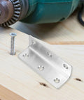 8 Pack Stainless Steel L Shaped Corner Brackets For 90 Degree Furniture And Cabinet Support on a wooden surface with drill and screw