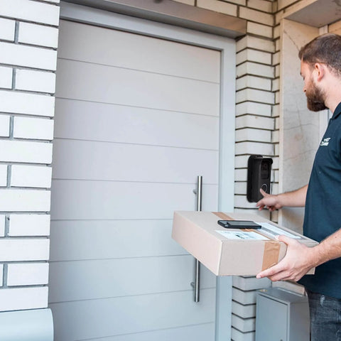 Delivery person using video doorbell with Adjustable Angle Mounting Bracket For Video Doorbell 2021 Black No Fuss Easy Install