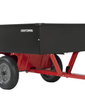 Black and red Workhorse Tow Behind Dump Cart with 750 lb capacity, removable tailgate, 12 cu ft bed, 16 inch tires, for yard work.