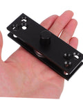 Hand holding a Heavy Duty 360 Degree Hidden Door Pivot Hinge for Concealed Cabinets and Bookcases, stainless steel, black finish.
