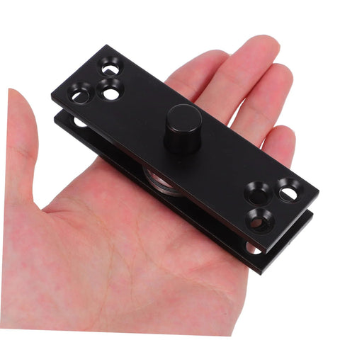 Hand holding a Heavy Duty 360 Degree Hidden Door Pivot Hinge for Concealed Cabinets and Bookcases, stainless steel, black finish.