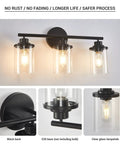 Three Light Matte Black Vanity Light With Clear Glass Shades For Bathroom, showing lit bulbs and close-up of details