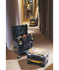 Tool Storage Organizer Cart For TSTAK System with Heavy Duty Wheels shown in a job site hallway with tools inside and on top