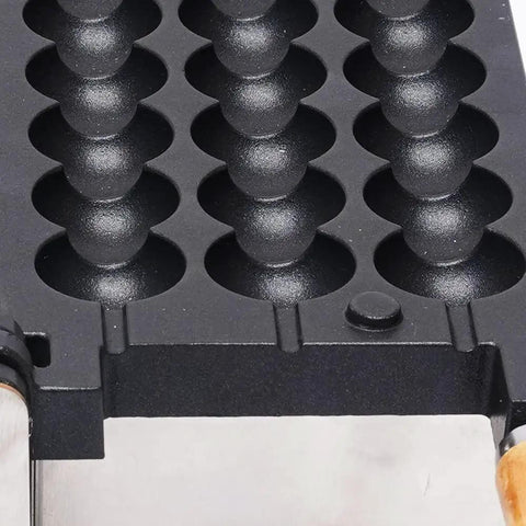 Detail of the waffle mold of the Slap Together Delicious Treats With This Commercial 1800W Bubble Skewer Waffle Ball Machine.