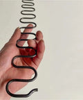 Top Notch Zig Zag Sofa Springs With Clip And Nail Kit For Saggy Chair Repair and Furniture Restoration shown in hand.