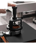 Automatic Rotating Wdt Tool Espresso Needle Distributor Anti Clumping Coffee Grinder Accessory 53 Mm in use on coffee grounds.