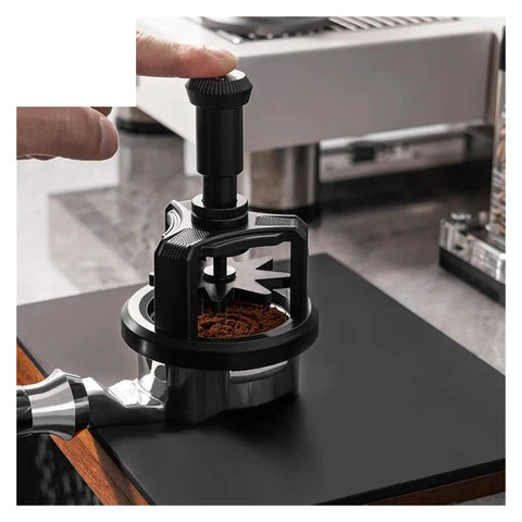 Automatic Rotating Wdt Tool Espresso Needle Distributor Anti Clumping Coffee Grinder Accessory 53 Mm in use on coffee grounds.