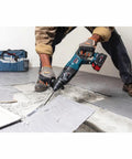 Worker using 5 Inch Wide Floor Scraper Replacement Kit For SDS Plus Bulldog Tools With Durable Steel Blade Bolts Nuts And Washers