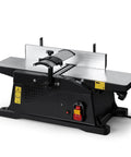 Six Inch Benchtop Jointer With 15 Amp Motor And 12000 Rpm For Slick Cuts Adjustable Fence Up To One Eighth Inch Depth Hss Blades Rock Solid Woodworking Table Jointer Kit on a black base with a sleek metal surface and fence.
