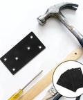 Beefy Heavy Duty Flat Plate Corner Brackets With Screws Black 10x5cm Set alongside hammer and screwdriver on white background