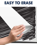 Hand erasing marks on the Grab-And-Go Mobile Magnetic Whiteboard And Flipchart Easel, 3x2 Feet, showing its easy-to-clean surface.