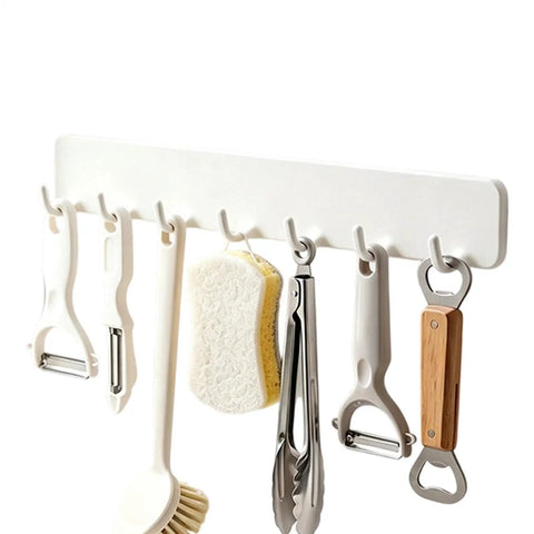 Premium Heavy Duty Self Adhesive Coat Rack Wall Mount Featuring Seven Robust Hooks For A Total Breeze Entryway Organization Dorm Room Key Holder Storage Rack with kitchen utensils.