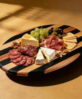 15.5 Inch Striped Walnut And Maple Round Lazy Susan Turntable for Dining Table with cheeses, olives, and crackers displayed