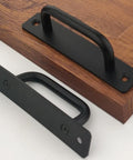 12 Pack Matte Black Aluminum Cabinet Pulls 5 Inch Length With 4 1/4 Inch Hole Center For Cabinets And Drawers, two pulls on wooden surface