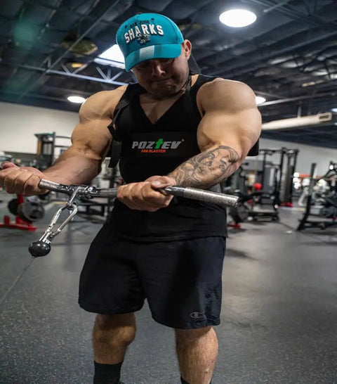 Man using Arm Blaster For Biceps And Triceps Isolation Dumbbell And Barbell Curl Support To Lock Your Elbows Improve Form And Build Them Guns Fast