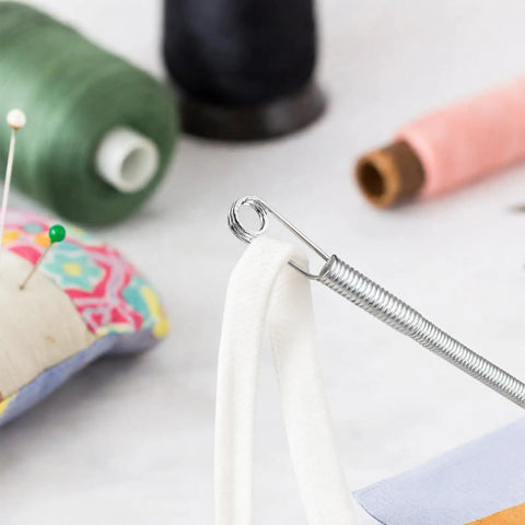 No Fuss Drawstring Threader Tool Flexible Spring Loaded Bodkin threading white cord for quick wardrobe repair.