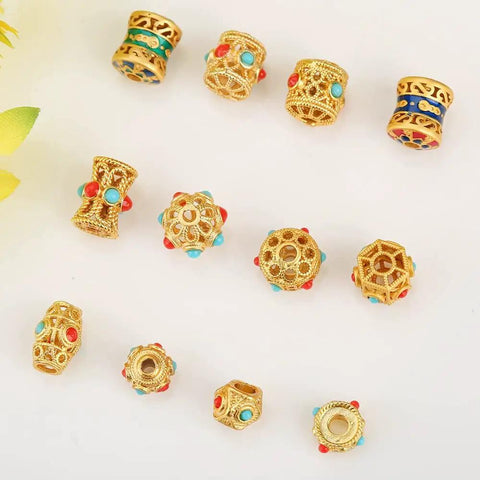 Grab These Dope Hollow Transfer Beads For Your Next DIY Jewelry Build And Stack Up Some Fire Sand Gold Spacer Charms Featuring A Sleek Baking Lacquer Coating Perfect For Chilling With Bracelets Necklaces Earrings And Custom Keychain Projects - assorted gold beads with red and turquoise accents