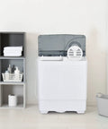 Straight Up A Smooth Portable Washing Machine With Twin Tub Layout, 26 Lbs Total Capacity Including An 18 Lbs Washer Plus 8 Lbs Spinner, Compact Electric Laundry Setup With Manual Dials And Drain Pump in a minimalist laundry space.