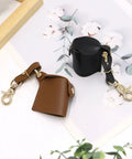 Compact Water Film Holder Case With Keychain Clip And Quick View Waterproof Film Storage Bag in black and brown leather.