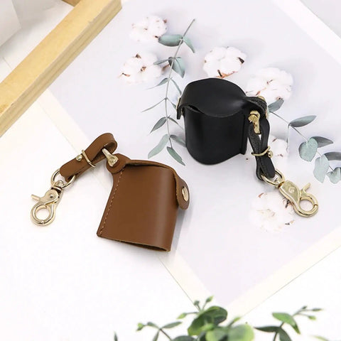 Compact Water Film Holder Case With Keychain Clip And Quick View Waterproof Film Storage Bag in black and brown leather.