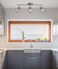 Cedrick 3 Light Track Lighting In Brushed Nickel above modern kitchen sink, adjustable heads, vintage Edison bulbs, farmhouse style.