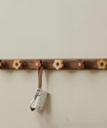 Dang Cute Flower Peg Wall Mount Coat Rack For Kids Crafted From Solid Walnut Wood Storage with flower-shaped hooks for keys.
