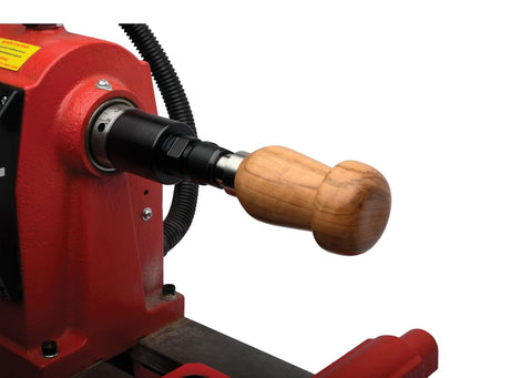 Handle Anything Chuck System for Woodturning Projects Kit With Collet Chuck Base PKHA01 mounted on lathe with wooden handle.