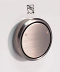 Rock Solid Bathtub Overflow Drain Cover With Deep Soak Round Profile Two Hole Universal Fit Satin Nickel on a wall.