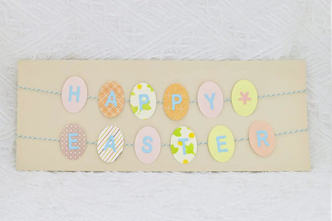 Easter-themed banner with pastel oval cutouts, crafted using Oval Easter Egg 1.5 Inch Lever Action Craft Punch for decoration