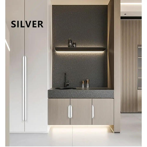 Hidden Aluminum Cabinet Handles For Doors And Drawers in a modern kitchen, featuring long silver pulls with smooth edges, easy install.