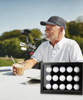 Man enjoying drink outdoors next to Top Notch Wood Golf Ball Display Case For 15 Balls, Wall Mount Or Freestanding Shadow Box With EVA Foam Protection