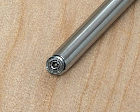 Close-up of a metal woodturning tool shaft with interchangeable handle connection for a wood lathe