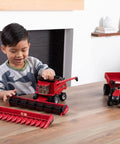 Child playing with 1/32 Scale Harvest Set With Interchangeable Heads And Movable Augers, Realistic Grain Cart, AFS Connect Magnum 380 Tractor
