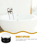 Universal Bathtub Drain Stopper Press Plug with Copper Core installed in a stylish white bathtub with modern fixtures.