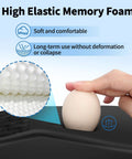 Hand pressing egg on Ergonomic Mouse Pad With Wrist Support And Gel Memory Foam Non Slip Base Pain Relief For Home Office