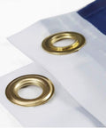 Close-up of double-stitched edge and brass grommets on 2x3 Indoor Outdoor US Flag made from polyester nylon.