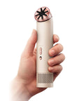 Person holding HushJet Mini Personal Fan With Quiet Evaporative Cooling, Up To Fifty-Five MPH Airflow, in Stone and Blush