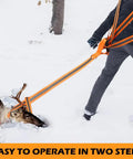 Hunter using Two Pack 60 Inch Deer Drag Rope With 59 Inch Dual Harness Reflective Shoulder Straps And Storage Bag in snow