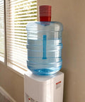 5 Gallon BPA Free Water Bottle Reusable Jug With Large Capacity Polycarbonate Container Universal Top Load And Bottom Load Dispenser Compatibility For Home And Office Use on white dispenser