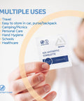 Person holding BZK Antiseptic Towelettes Sterile Alcohol Free Fragrance Free Gentle Clean For Minor Wounds No Fuss 5 By 7 Inch