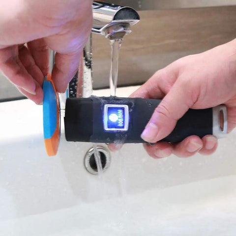 Rugged IP67 Waterproof 125kHz RFID Guard Tour System in use under running water, demonstrating waterproof capability.