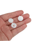 Hand holding white caps from Plastic Screw Cover Caps Set 400 Pieces Hinged Design Multi Color Assorted For Furniture Tables And Cabinets
