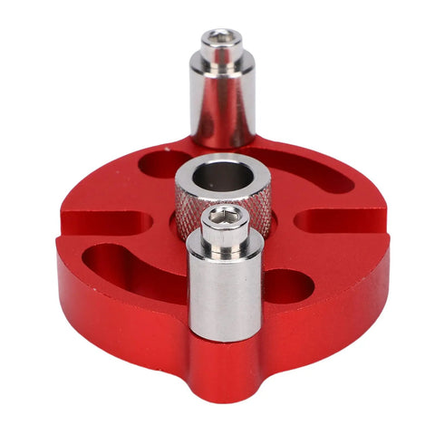 Heavy Duty Workhorse Self Centering Doweling Jig Built From Rock Solid Anodized Aluminum Alloy, close-up view of red jig with stainless steel bushings.