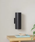 Dusk To Dawn Outdoor Wall Light With Up And Down Sconces Waterproof Anti Rust Cylinder Black on a modern wooden shelf